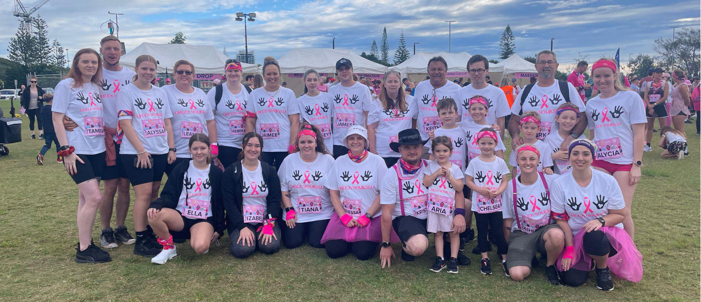 Group of people wearing t-shirts with the cancer logo during the mother's day classic event